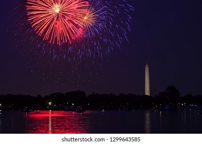 Fourth of July fireworks on the National Park tidal basin, with the Washington Monument in Washington, District of Columbia