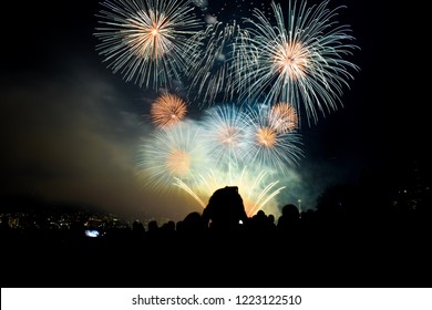 Fourth Of July Fireworks In Seattle With People Watching And Taking Pictures With Space Needle In Background