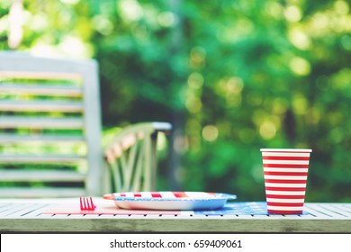 Fourth Of July Party Table Setting With Plate And Cup Outside