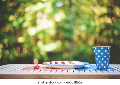 Fourth Of July Party Table Setting With Plate And Cup Outside