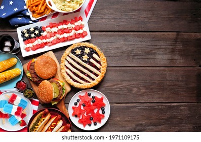 Fourth of July, patriotic, American themed food. Top view side border on a dark wood background. Copy space.