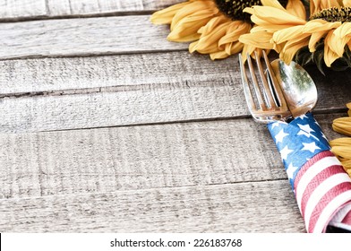 Fourth of July Table Setting on Rustic Board Background with room or space for copy, text, your words.  Horizontal looking down from above