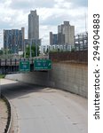 fourth street at freeway entrance for 35W in downtown Minneapolis and housing development cityscape 