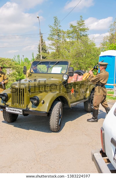 GAZ-69А is four-wheel drive light truck, produced\
by GAZ. Volgograd (Stalingrad) Russia - April 30, 2016. Summer\
sunny day. Parade rehearsal before May 9. World War II (WWII or\
WW2).