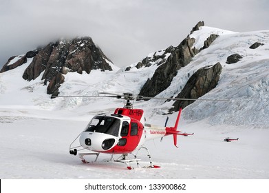 FOX GLACIER, NZ - MAR 07 2009:Two Helicopters On Top Of Fox Glacier.It's  A 13 Km (8.1 Mi) Long Glacier Located In Westland National Park On The West Coast Of New Zealand's South Island.