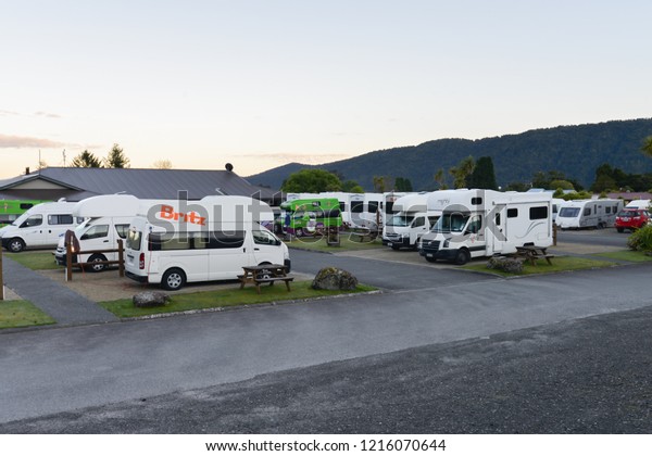 Fox gracia / New\
Zealand - October 29 2017 : Camper van is parking at the the\
carpark area in\
accommodation