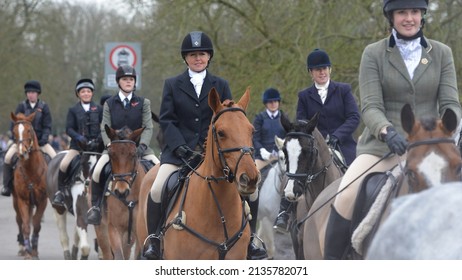 Fox Hunters Ride Along A Street During The Traditional Boxing Day Hunt On December 26, 2013 In Chippenham, UK. Fox Hunting Is Technically Outlawed In The UK With Meets Following Scented Trails.