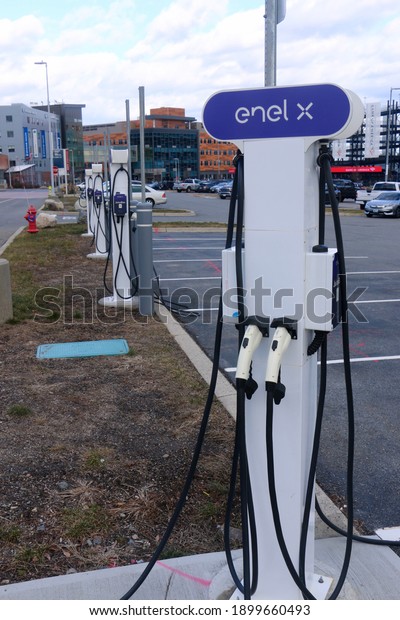 Foxborough, Massachusetts, USA - January 17, 2021:
Enel X electric vehicle charging stations at the Gillette Stadium
parking lot
