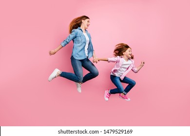 Foxy Small Lady And Her Mom Jumping High Rushing Toy Shop Wear Casual Jeans Outfit Isolated Pink Background