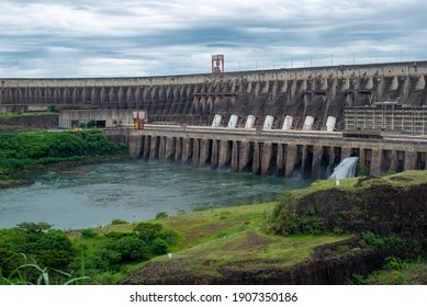 Foz do Iguaçu, Brazil - January 26, 2021: Panoramic view of the Itaipu hydroelectric plant with water gushing through the floodgates. Clean and renewable energy.