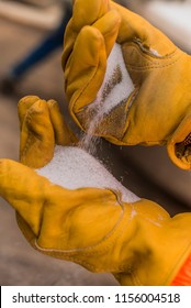 Frac Sand In Hand Of Oil Worker