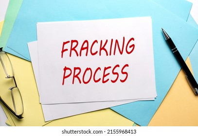 FRACKING PROCESS text on a paper on the colorful paper background