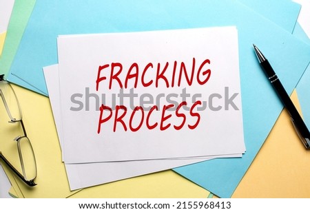 FRACKING PROCESS text on a paper on the colorful paper background