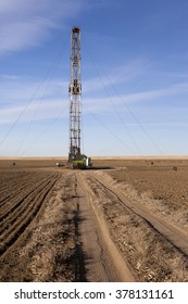 Fracking Rig In A Farm Field.