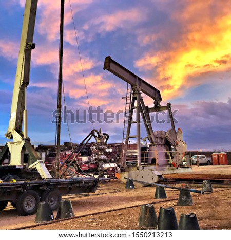 Fracking, well head connected to fracking pumps.