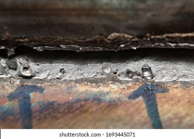 Fracture test specimen for fillet weld welder qualification, to expose welding defects on the fracture at middle grey area in photo if any, porosity appears as smooth surface and rounded in shape. - Shutterstock ID 1693445071