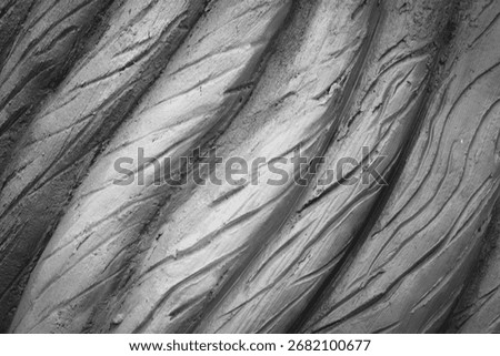 Fractured rock with angular shards and sharp crevices.