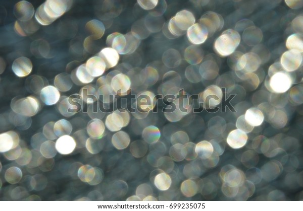 Fractured window breaking the sunlight, light\
dots, abstract bokeh\
background