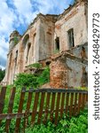 Fragment of abandoned Dominican Church of St. Anthony in agrotown of Knyazhitsy, Mogilev Region, Belarus. Summer rural landscape