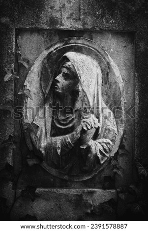 Fragment of ancient statue of Mary Magdalene (Prayer, faith, religion, love, hope concept) Black and white image.