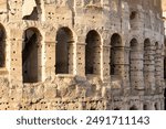 Fragment of arches of Colosseum or Coliseum (Flavian Amphitheatre or Amphitheatrum Flavium or Anfiteatro Flavio or Colosseo. Rome, Italy