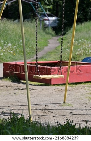 A fragment of the attractions of a deserted playground on a summer day
