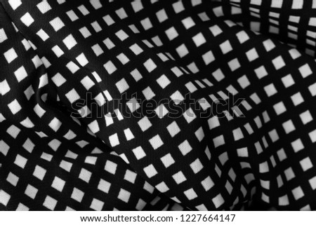 Similar – fragment of black cotton fabric with waves