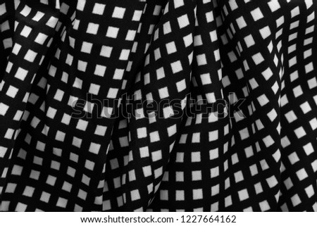 Similar – fragment of black cotton fabric with waves