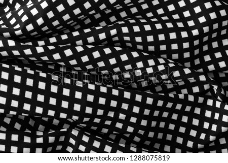 Similar – fragment of black cotton fabric with waves