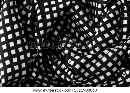 Similar – fragment of black cotton fabric with waves