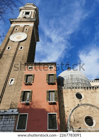 Fragment of buildings on the streets of Venice. Clock building.