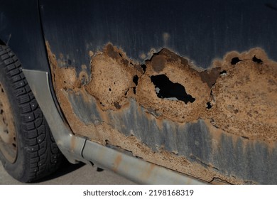 Fragment Of A Car Body With Rust. Corrosion Resistance, Body Repair, Rust. Protection