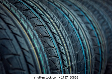 Fragment Of Car Tires In An Unusual Perspective. Unusual Background And Texture. Computer Desktop Wallpaper.