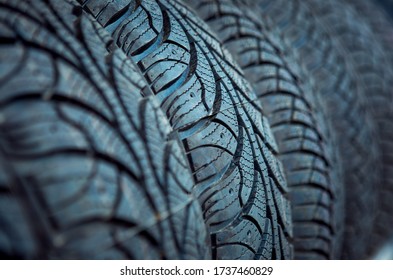 Fragment Of Car Tires In An Unusual Perspective. Unusual Background And Texture. Computer Desktop Wallpaper.