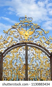 Fragment of Catherine palace fence in Tsarskoye Selo with golden double-headed eagle, suburb of St.Petersburg, Russia.
