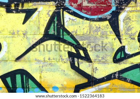 Fragment of colored street art graffiti paintings with contours and shading close up