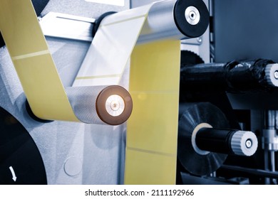 Fragment of the conveyor of sticking labeling machine. Abstract industrial background. - Shutterstock ID 2111192966