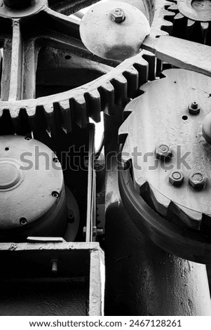 Fragment of a crane device, close-up of the wheels and pawls