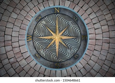 Fragment Decorative Compass Points With Compass Rose Directions, On The Ground.