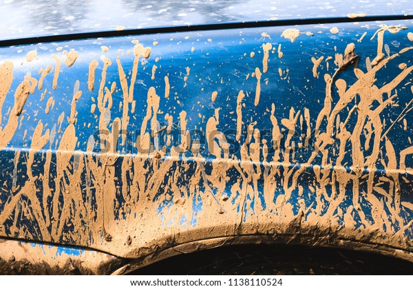 Fragment of dirty\
car in rural areas\
close-up