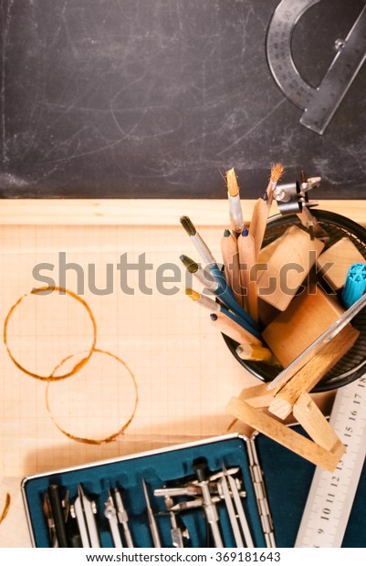 Fragment of\
engineer\'s workplace and drawing\
tools.