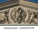 Fragment of the facade of the building of the Bolshoi Theatre, Moscow. Two-headed eagle crowned with imperial crowns.