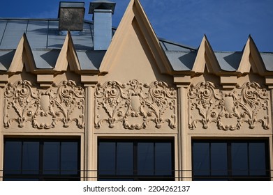 A Fragment Of The Facade Of A Historical Building With A Decorated Parapet