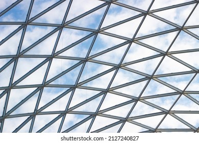 A fragment of a glass dome on the roof of the building. Geometric glass dome. Modern ceiling architecture - Powered by Shutterstock