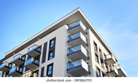 Fragment Of Modern Luxury Residential Apartment,  Home House Building Concept. Modern Apartment Building On A Sunny Day With A Blue Sky.