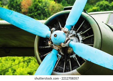 Fragment Of An Old Aircraft With Propeller And Engine. Close Up