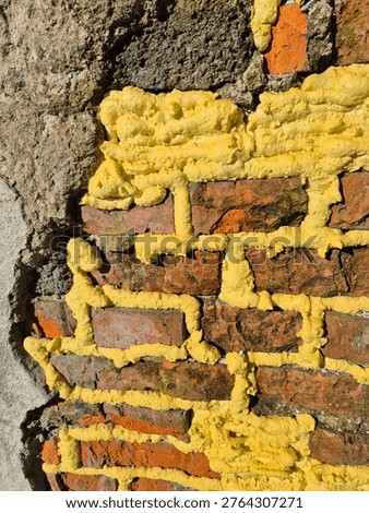 A fragment of an old brick wall. Improperly repaired brickwork 