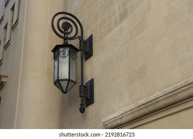 Fragment Of An Old French Building. Wall Mounted Old-time Street Lamp.