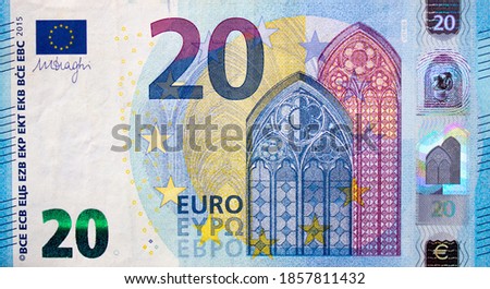 Fragment part of 20 euro banknote close up with small blue details