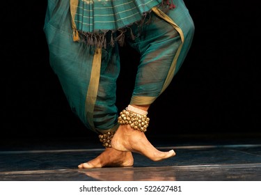 Fragment photo of indian dancer, only legs cropped, Legs fragment photo of indian dancer. Man from folk music group presenting traditional indian costume. Dancer in movement photo